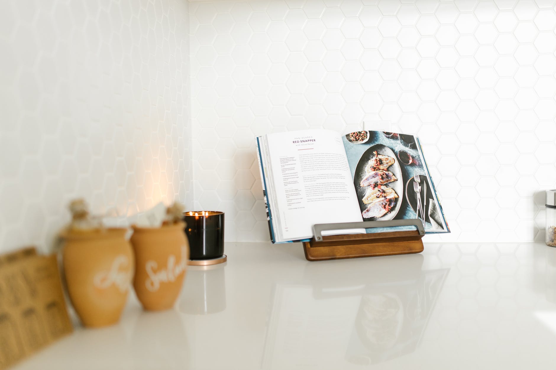 an open cookbook on a kitchen counter